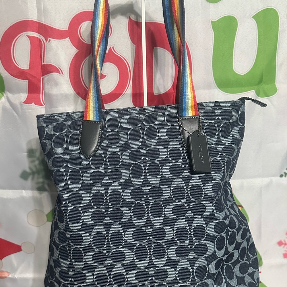 -Sold-Coach tote bag in signature denim with a rainbow strap.